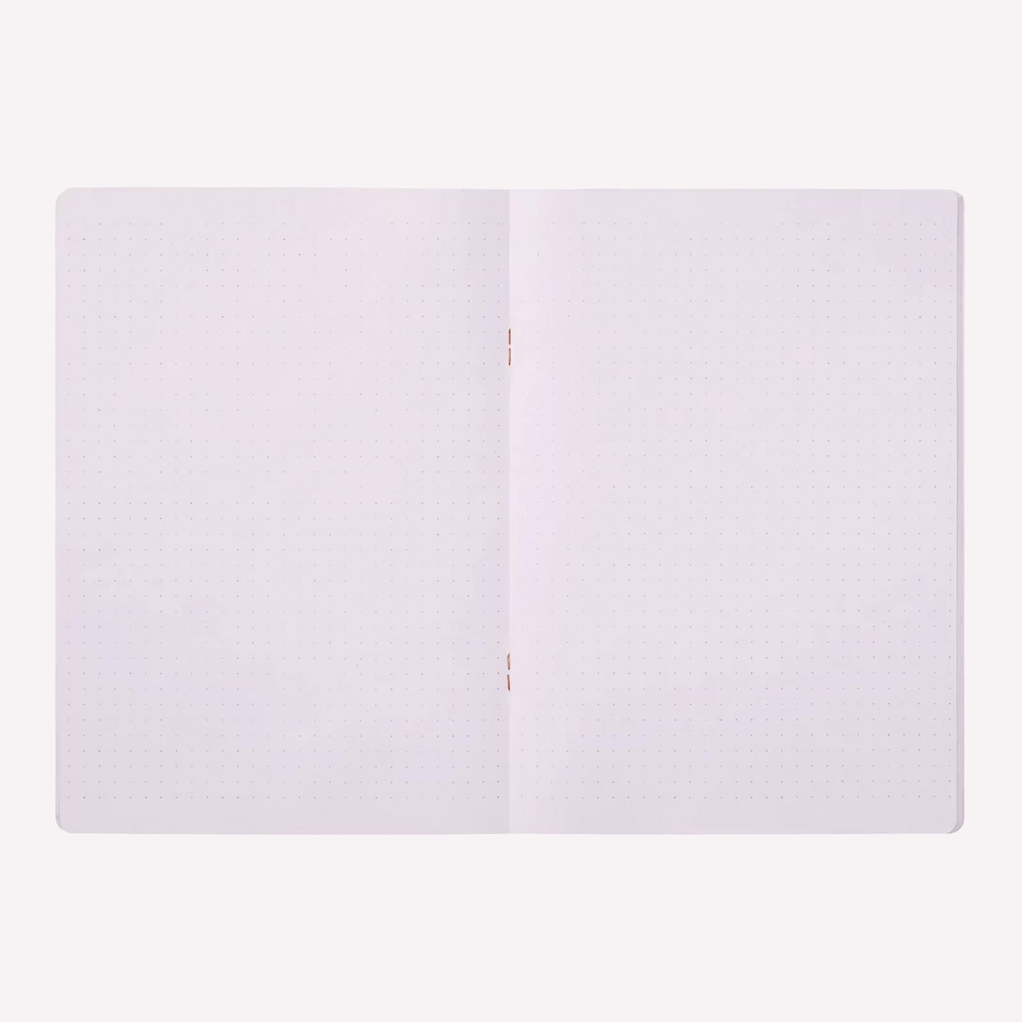Inside the Midori soft cover stapled notebook. Dot grid pages are a pale purple with a 5mm spacing. 