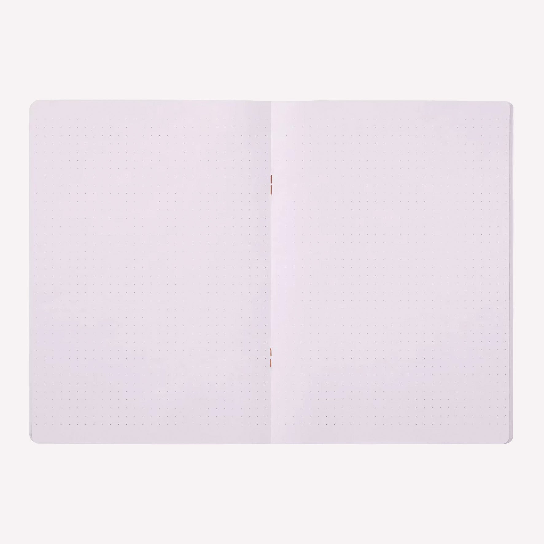 Inside the Midori soft cover stapled notebook. Dot grid pages are a pale purple with a 5mm spacing. 