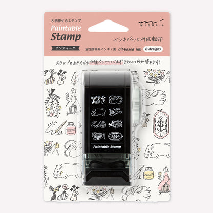 Midori paintable rotating stamp with 8 different designs themed around antique cat and flower illustrations presented in packaging to show the designs. 