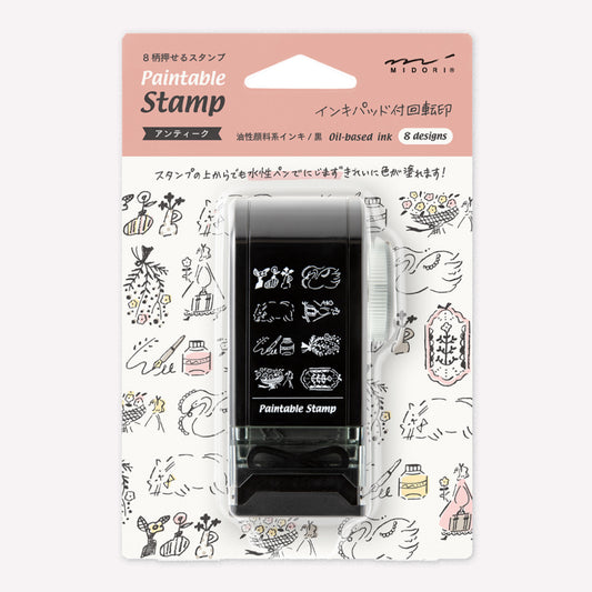 Midori paintable rotating stamp with 8 different designs themed around antique cat and flower illustrations presented in packaging to show the designs. 
