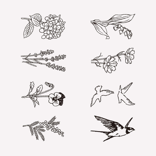 8 illustrated antique style designs of birds and floral designsand flowers included in midori's "Bird and Flower" rotating ink stamp. 