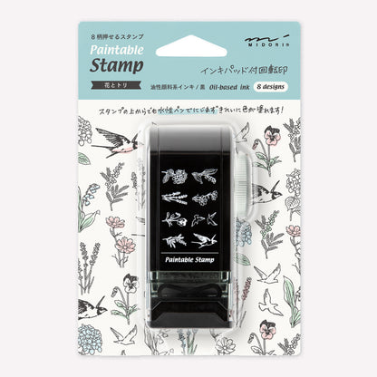 Midori paintable rotating stamp with 8 different designs themed around bird and flower illustrations presented in packaging to show the designs. 
