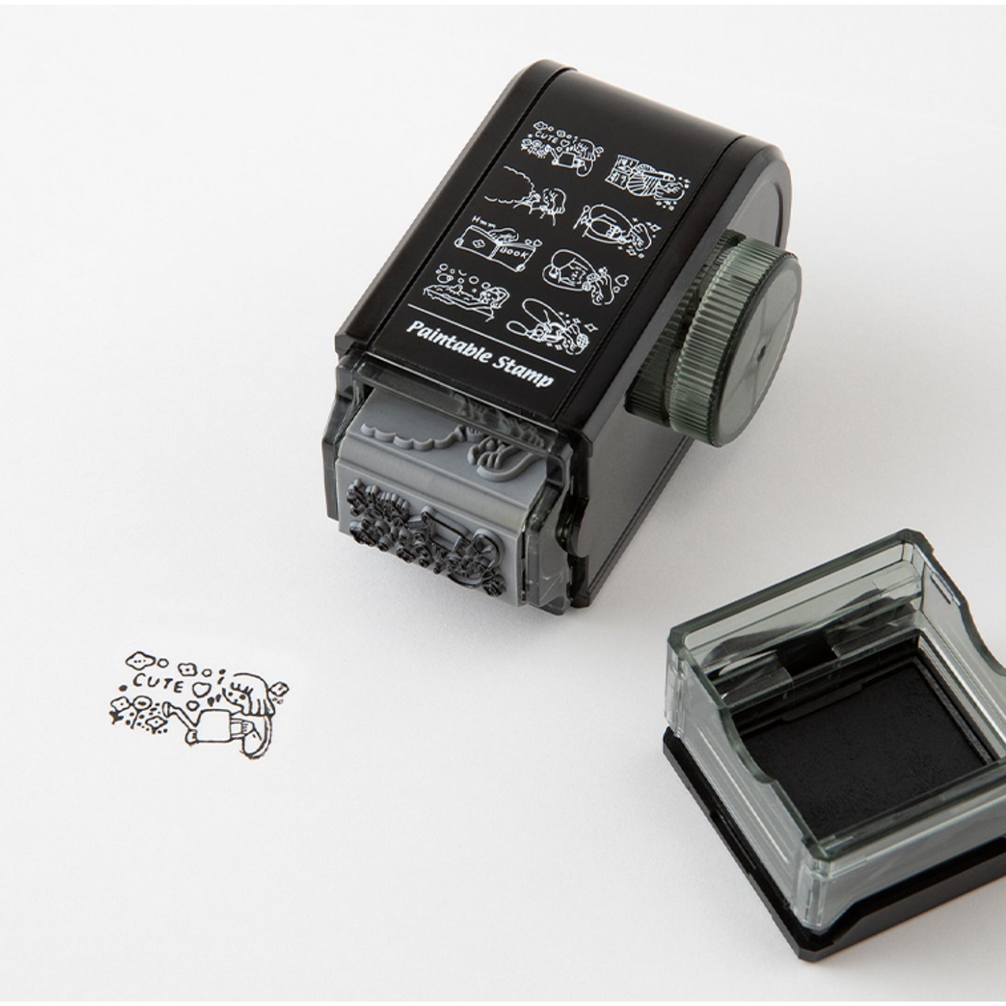 Lifestyle image of Midori's journal girl life rotating paintable stamp in use. 
