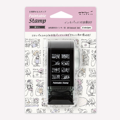 Midori paintable rotating stamp with 8 different designs themed doing different hobbies, presented in packaging to show the designs. 