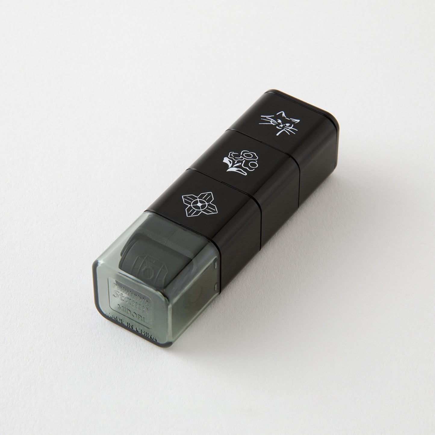 Set of 3 Midori paintable ink roller stamp, featuring dog, floral and building skyline designs. 