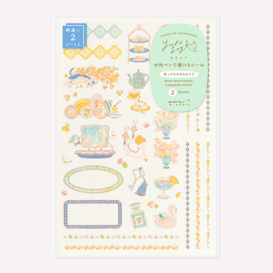 Midori Travel & Hotel Yuru Log decorative sticker sheet with designs including afternoon tea, jewellery, floral vases and decorative borders, packaged in a protective plastic sleeve. 