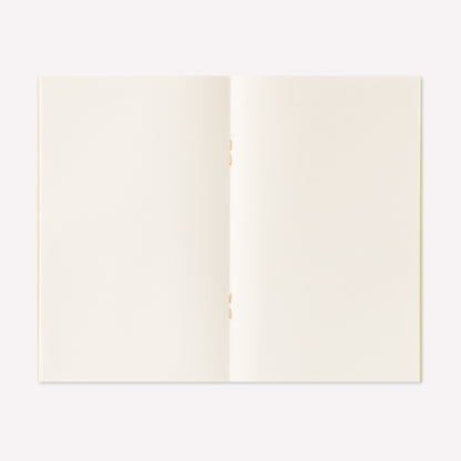 Midori peelable sticker book with a yellow cover displayed open to show the sticker release paper inside. 