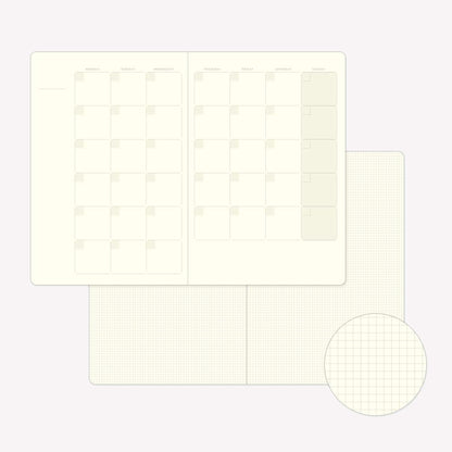 Inside pages of the Midori Yuru Log Free Diary Monthly featuring an undated monthly calendar spread and 2mm square grid pages. 