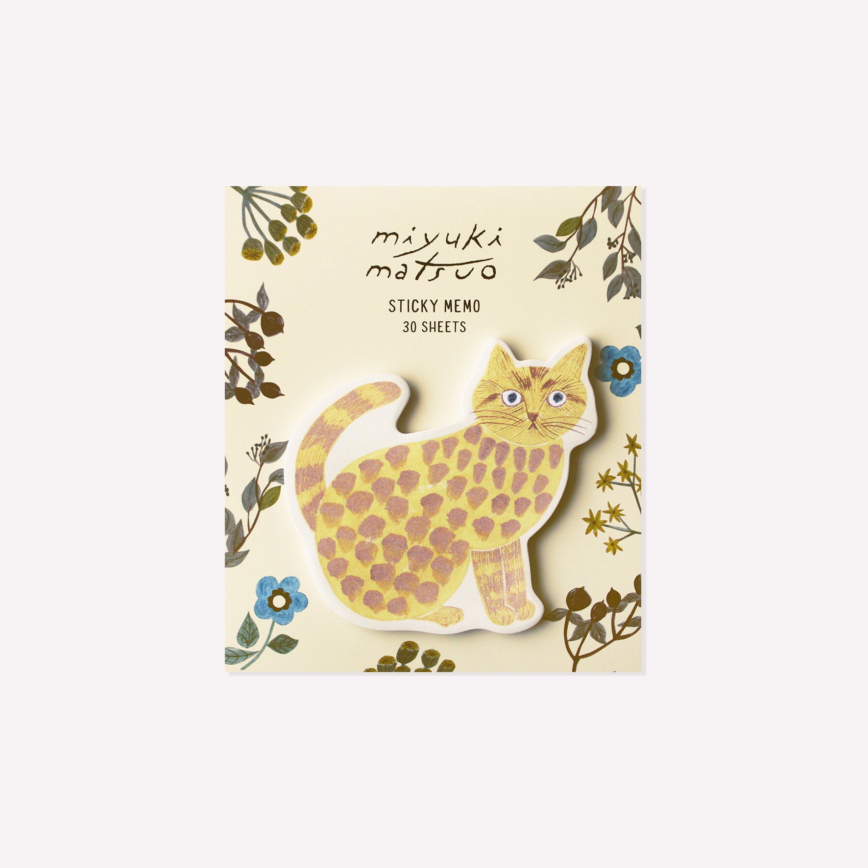 rosette cat shaped die cut sticky memo pad presented on a purple floral background. 