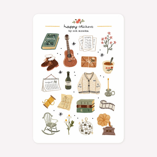 Folklore themed sticker sheet by Och Monika, with hand-drawn designs including a guitar, lyric sheets, a disco ball and the folklore cardigan.
