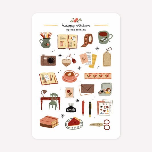 Journal themed sticker sheet by Och Monika, with hand-drawn designs including a camera, washi tapes, scissors, pens and other scrapbooking ephemera.
