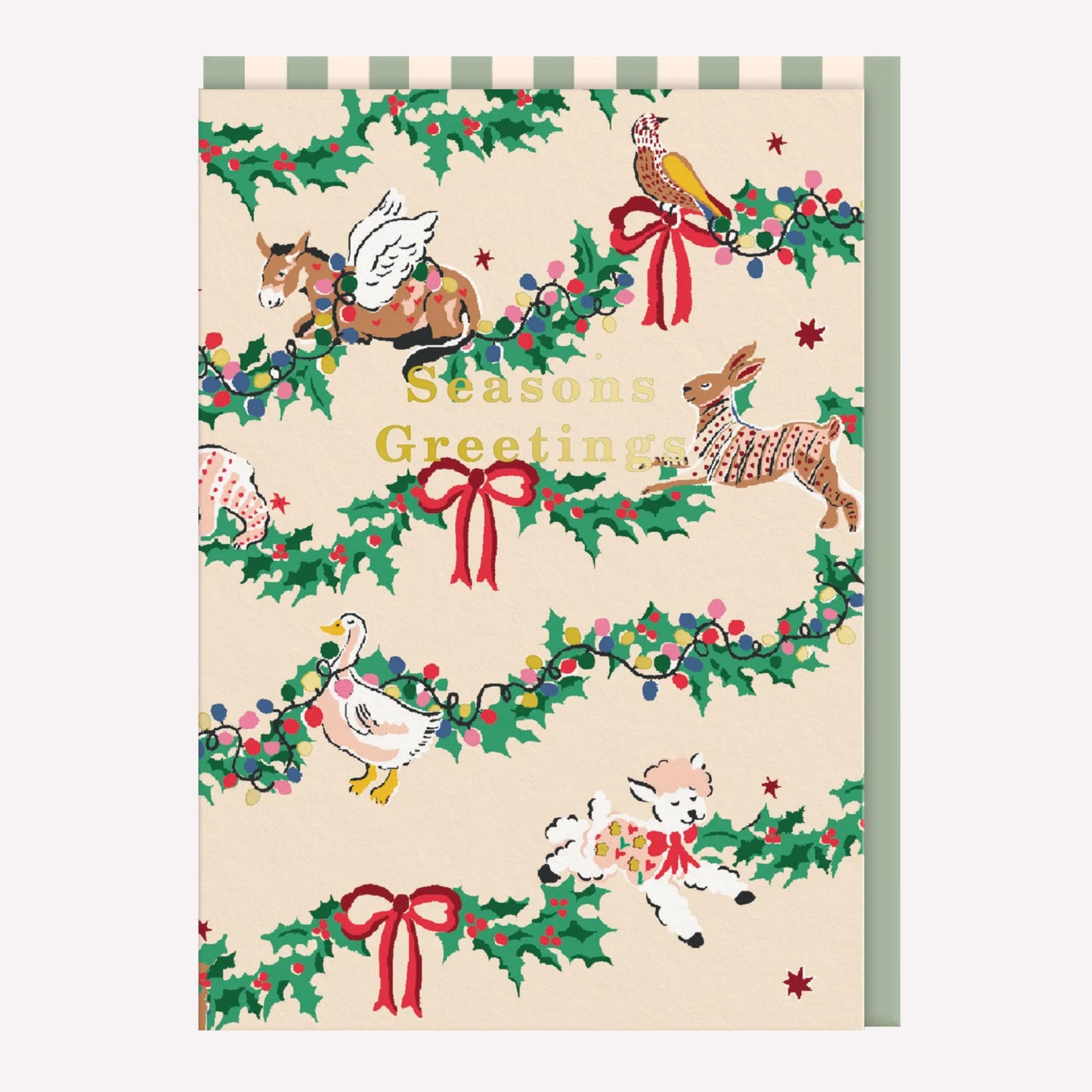 Christmas greetings card with illustrated animals and a holly garland design on a beige background. Gold foil text reads "Seasons Greetings."