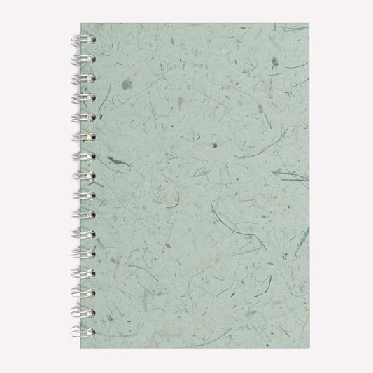 A5 sized Pink Pig Spiral bound sketchbook, with a textured seafoam green Thai banana leaf tissue paper cover and brown cartridge paper inside.