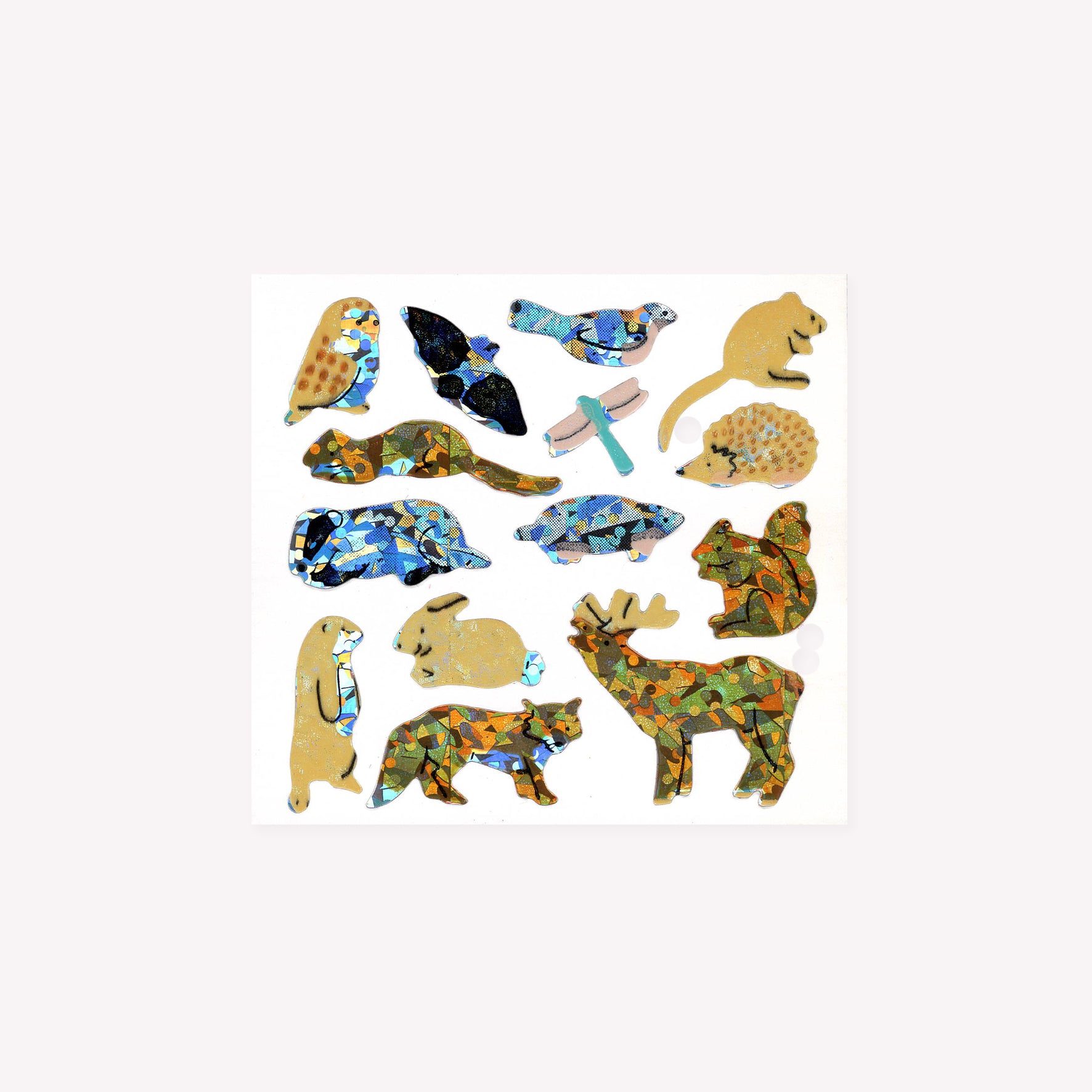 Fourteen prismatic forest animal stickers, including an owl, deer, rabbit and fox, on a mini sticker sheet from Stickermagic.
