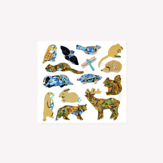 Fourteen prismatic forest animal stickers, including an owl, deer, rabbit and fox, on a mini sticker sheet from Stickermagic.