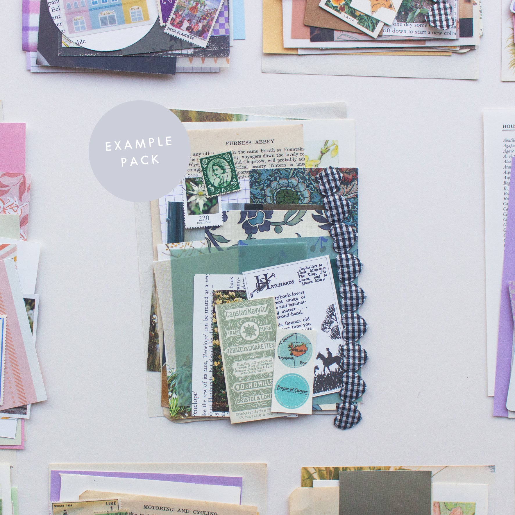 An example journalling & collaging scrap pack by Salt Art Supply. This green and blue colour themed pack includes patterned, coloured and textured papers, vintage tea cards, book illustrations, old stamps, ribbon and more.