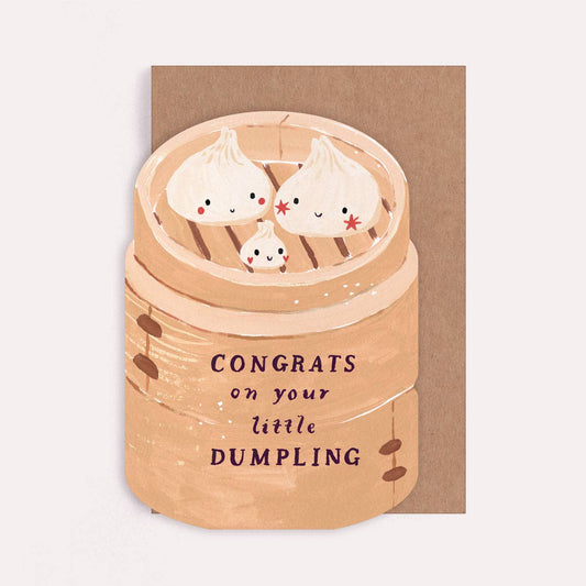 Illustrated die cut greetings card with a bamboo steamer and dumpling design, and text reading "Congrats on your Little Dumpling". 