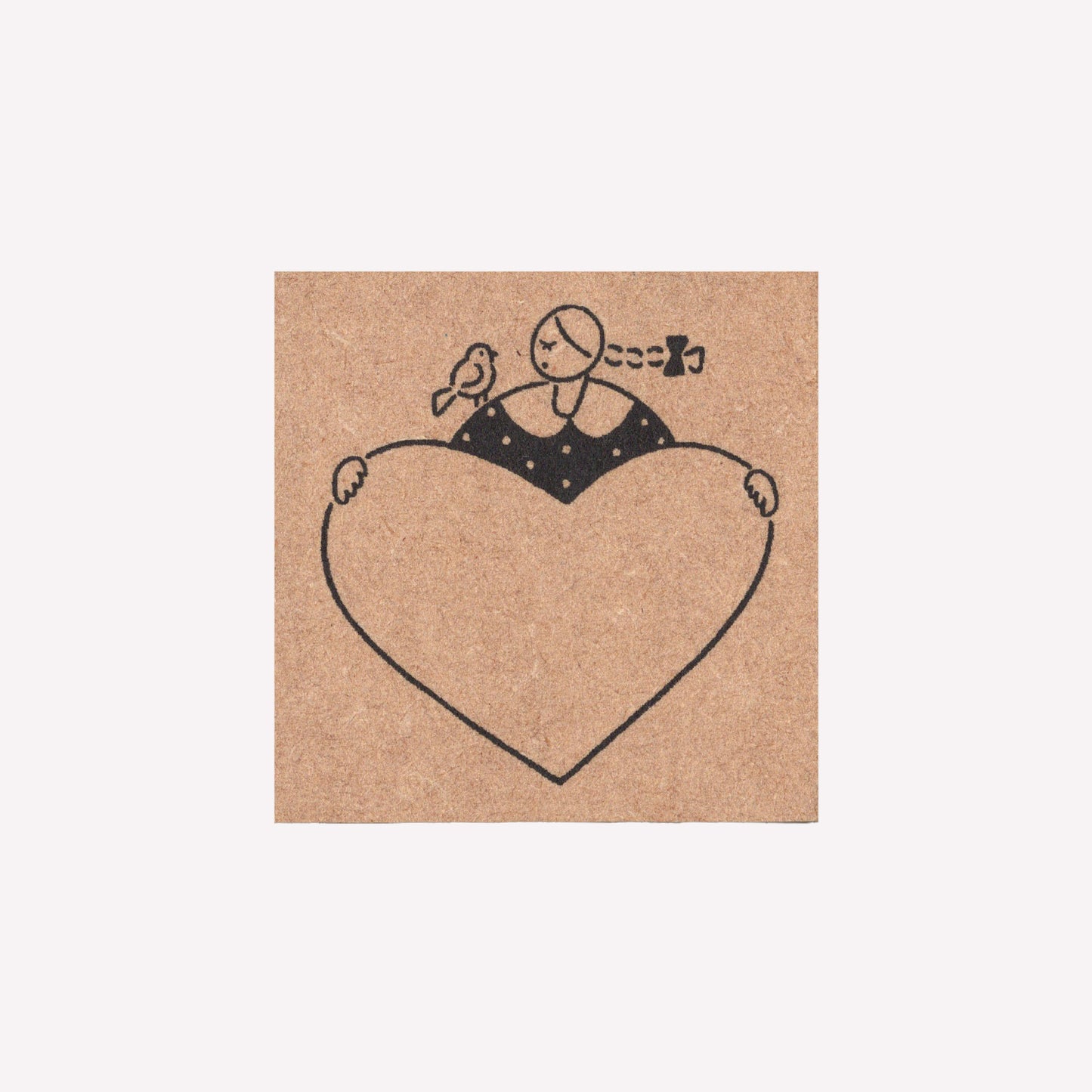Rubber journalling stamp with a design of a girl and bird holding a stamp frame. 
