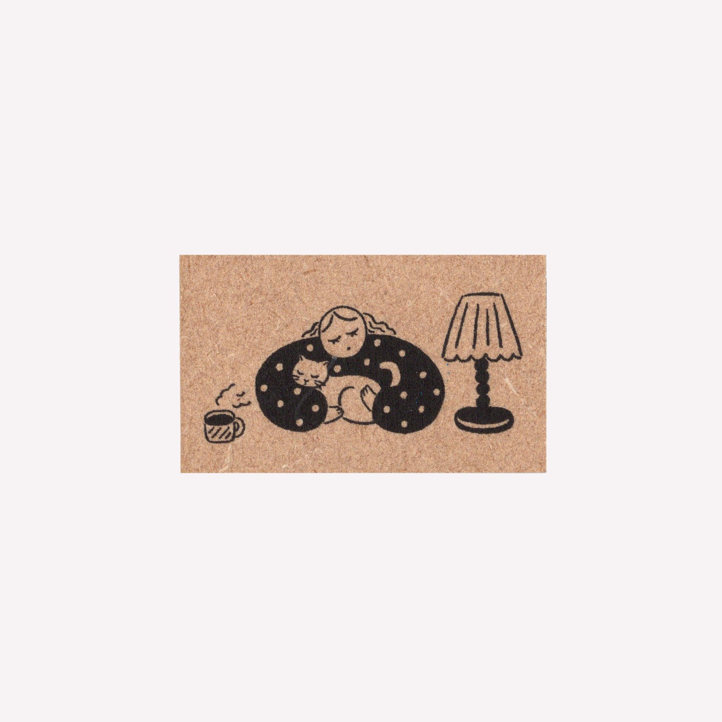 Rubber journalling stamp with a design of a girl and her cat with a cup of coffee and a lamp. 