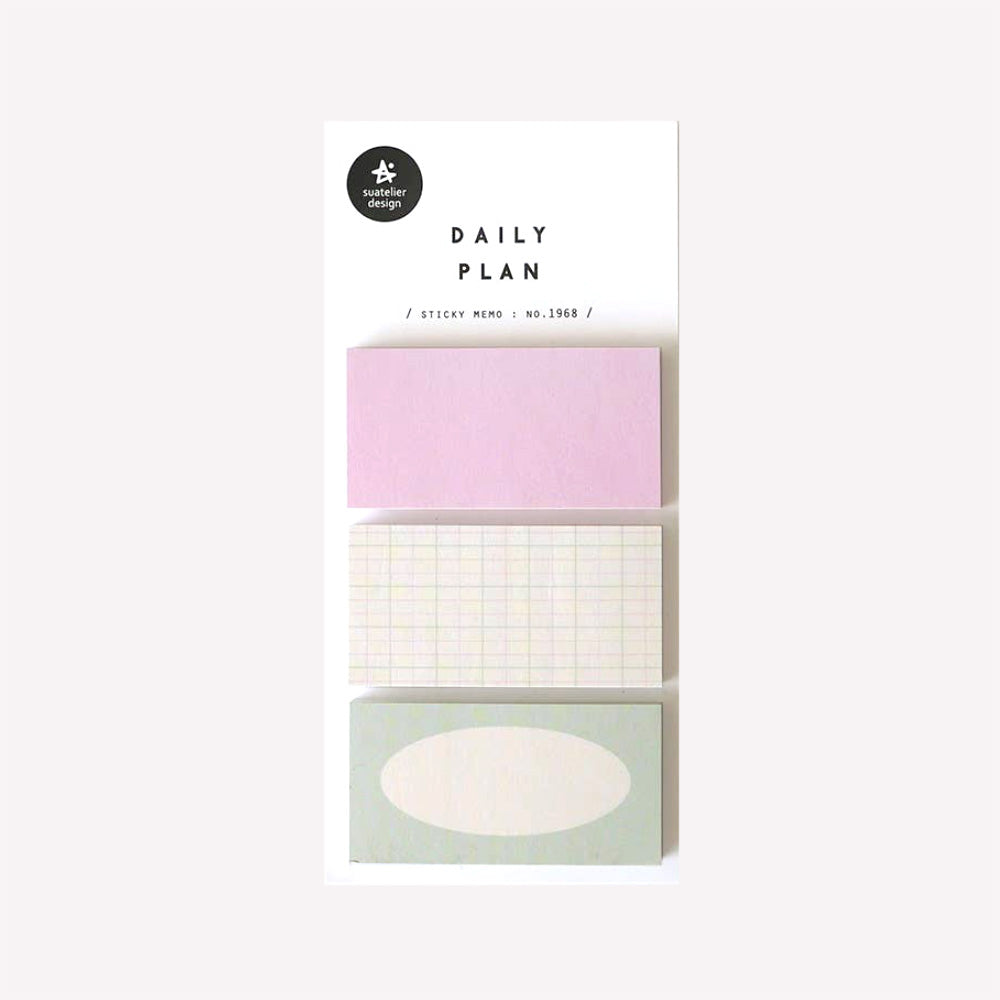Daily plan memo notes no. 1968 by Suatelier. This pack of sticky memo notes includes three designs, one plain pink, one green with a white oval and one with a light green and pink grid pattern.