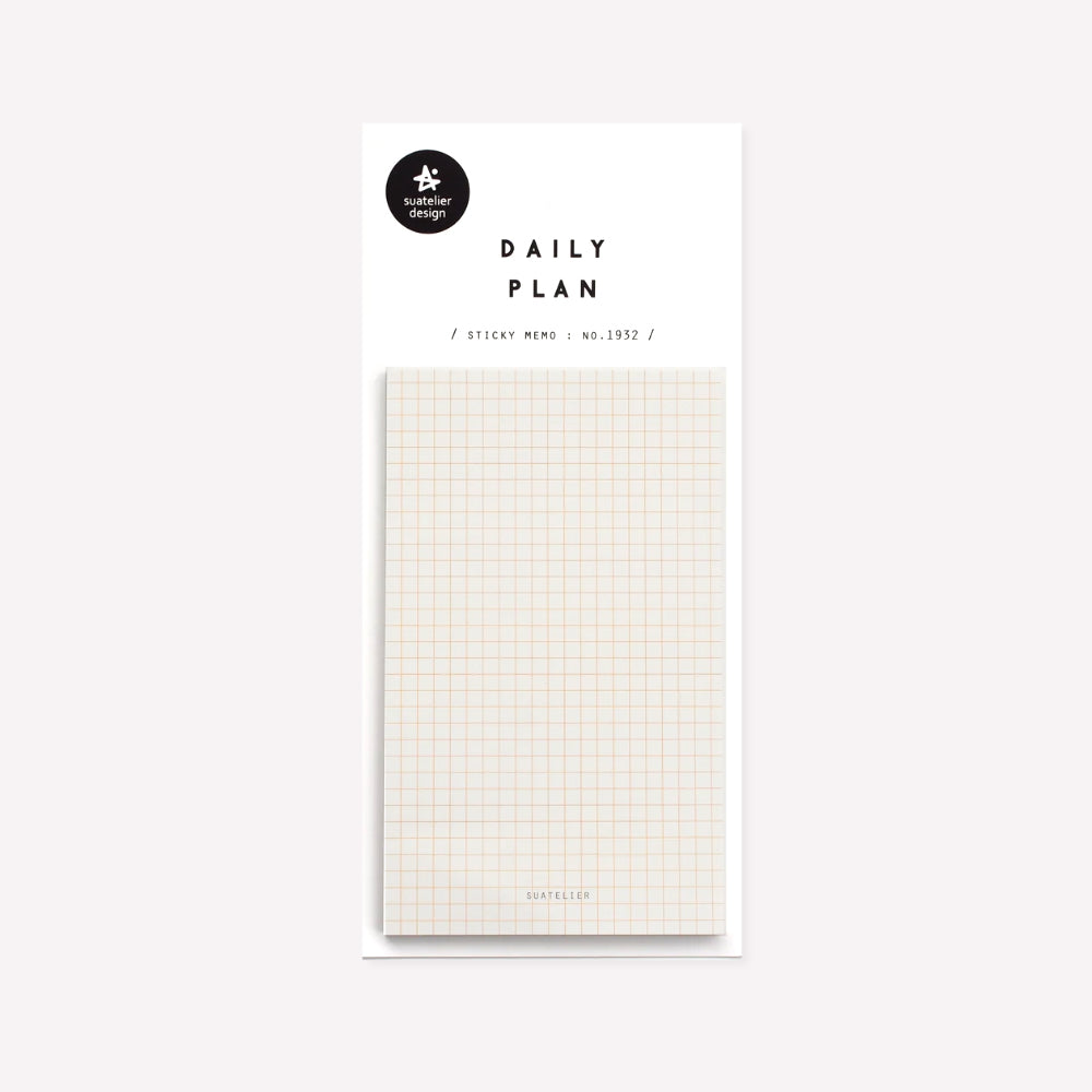 Daily plan memo notes no. 1932 by Suatelier. This pack of sticky memo notes includes one design in plain cream with a   light orange grid and small text reading "Suatelier" at the bottom.  
