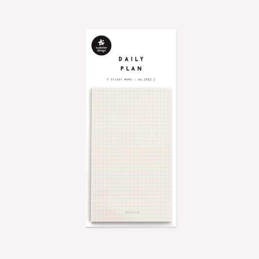 Daily plan memo notes no. 1932 by Suatelier. This pack of sticky memo notes includes one design in plain cream with a   light orange grid and small text reading "Suatelier" at the bottom.  