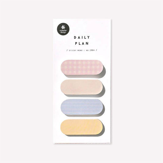 Daily plan memo notes no. 1964 by Suatelier. This pack of sticky memo notes includes four oval shaped designs, two plain in shades of yellow and two with a gingham or lined pattern in either pastel pink or pastel blue.