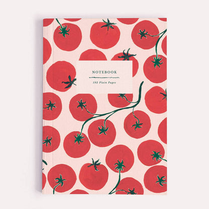 A plain paper notebook by Sister Paper Co, illustrated with a pattern of bright red tomatoes on the vine.