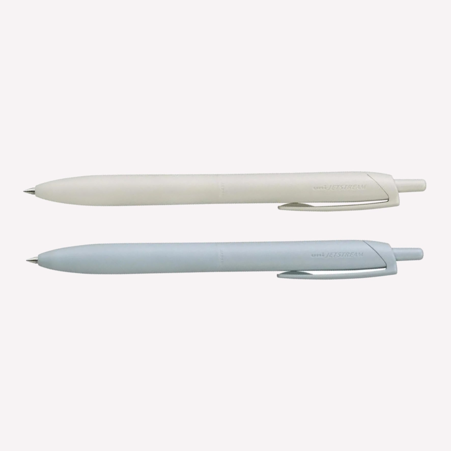 Uni Jetstream Lite Touch gel pens on a white background available in shell white and light blue. 