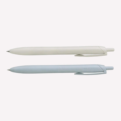 Uni Jetstream Lite Touch gel pens on a white background available in shell white and light blue. 