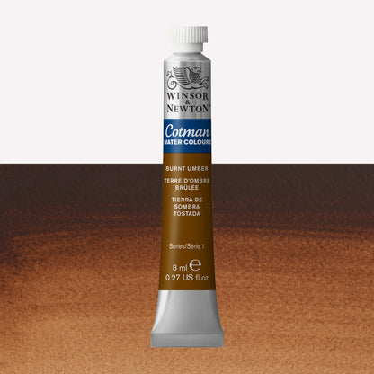 Winsor & Newton Cotman watercolour paint packaged in 8ml silver tube with a white lid in the shade Burnt Umber over a highly pigmented colour swatch.