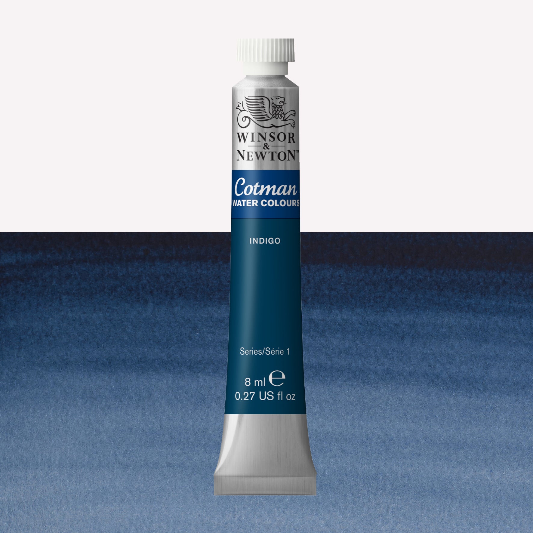Winsor & Newton Cotman watercolour paint packaged in 8ml silver tube with a white lid in the shade Indigo over a highly pigmented colour swatch.