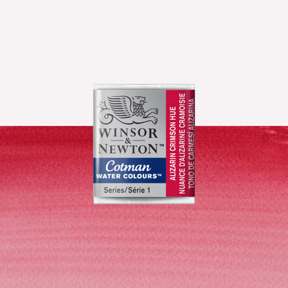 Winsor & Newton Cotman watercolour half pan in the shade Alizarin Crimson Hue over a vibrant colour swatch. These half pans have a solid formula and are packaged in compressed paint cake. 