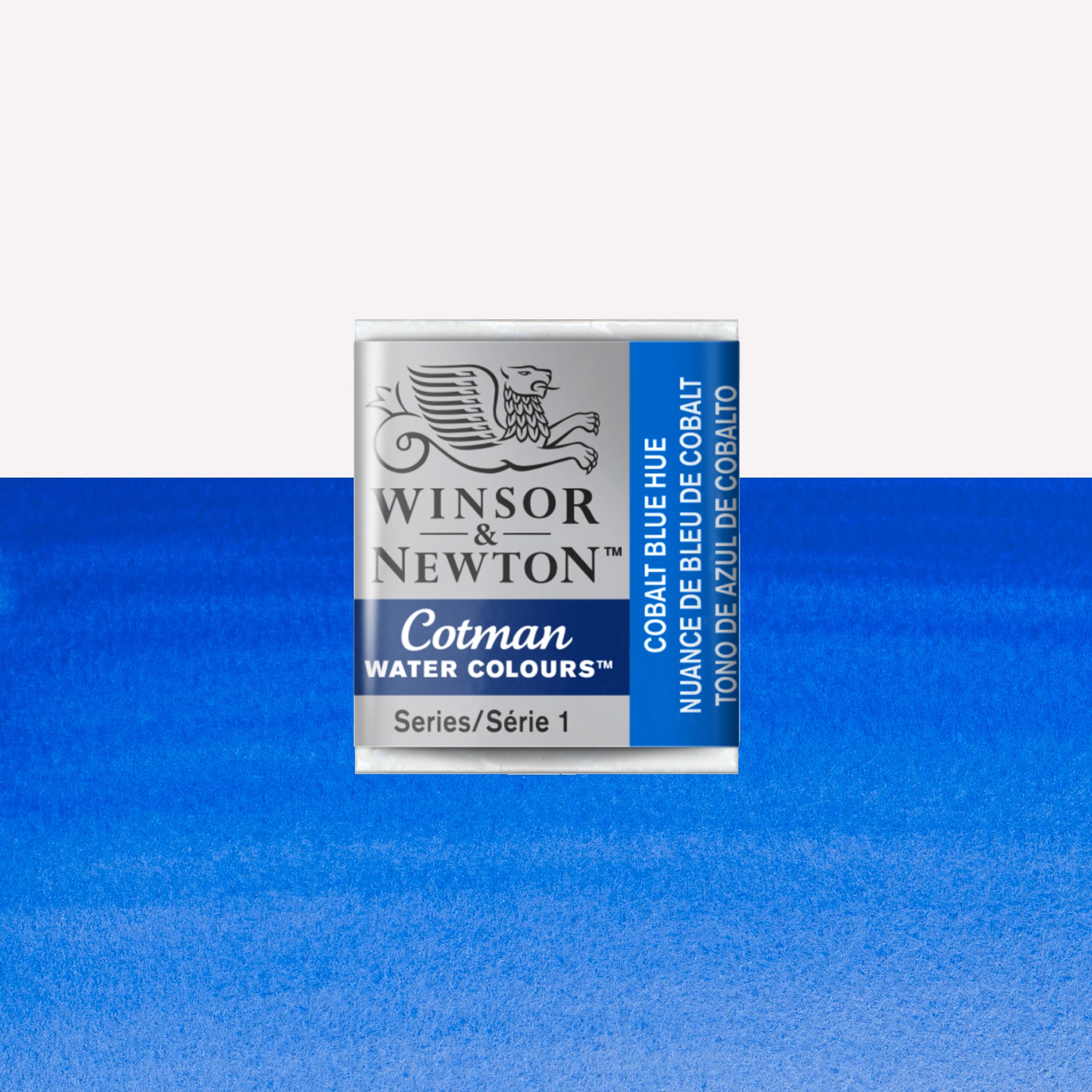 Winsor & Newton Cotman watercolour half pan in the shade Cobalt Blue Hue over a vibrant colour swatch. These half pans have a solid formula and are packaged in compressed paint cake. 