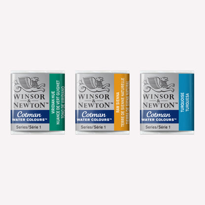 Set of three Winsor & Newton Cotman watercolour half pans in the shades Viridian Hue, Raw Sienna and Turquoise. These half pans have a solid formula and are packaged in compressed paint cake. 