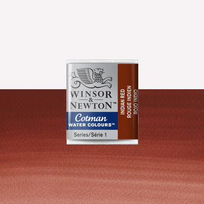 Winsor & Newton Cotman watercolour half pan in the shade Indian red over a vibrant colour swatch. These half pans have a solid formula and are packaged in compressed paint cake. 