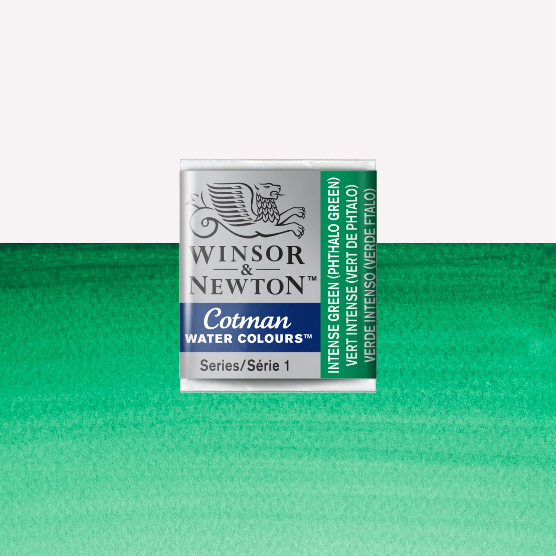 Winsor & Newton Cotman watercolour half pan in the shade Intense (Phthalo) Green over a vibrant colour swatch. These half pans have a solid formula and are packaged in compressed paint cake. 