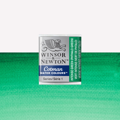 Winsor & Newton Cotman watercolour half pan in the shade Intense (Phthalo) Green over a vibrant colour swatch. These half pans have a solid formula and are packaged in compressed paint cake. 
