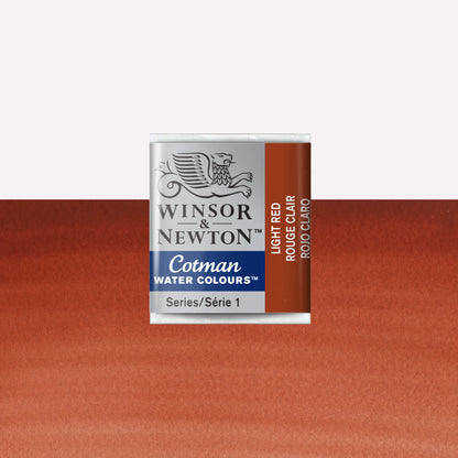 Winsor & Newton Cotman watercolour half pan in the shade Light Red over a vibrant colour swatch. These half pans have a solid formula and are packaged in compressed paint cake. 