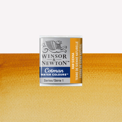 Winsor & Newton Cotman watercolour half pan in the shade Raw Sienna over a vibrant colour swatch. These half pans have a solid formula and are packaged in compressed paint cake. 