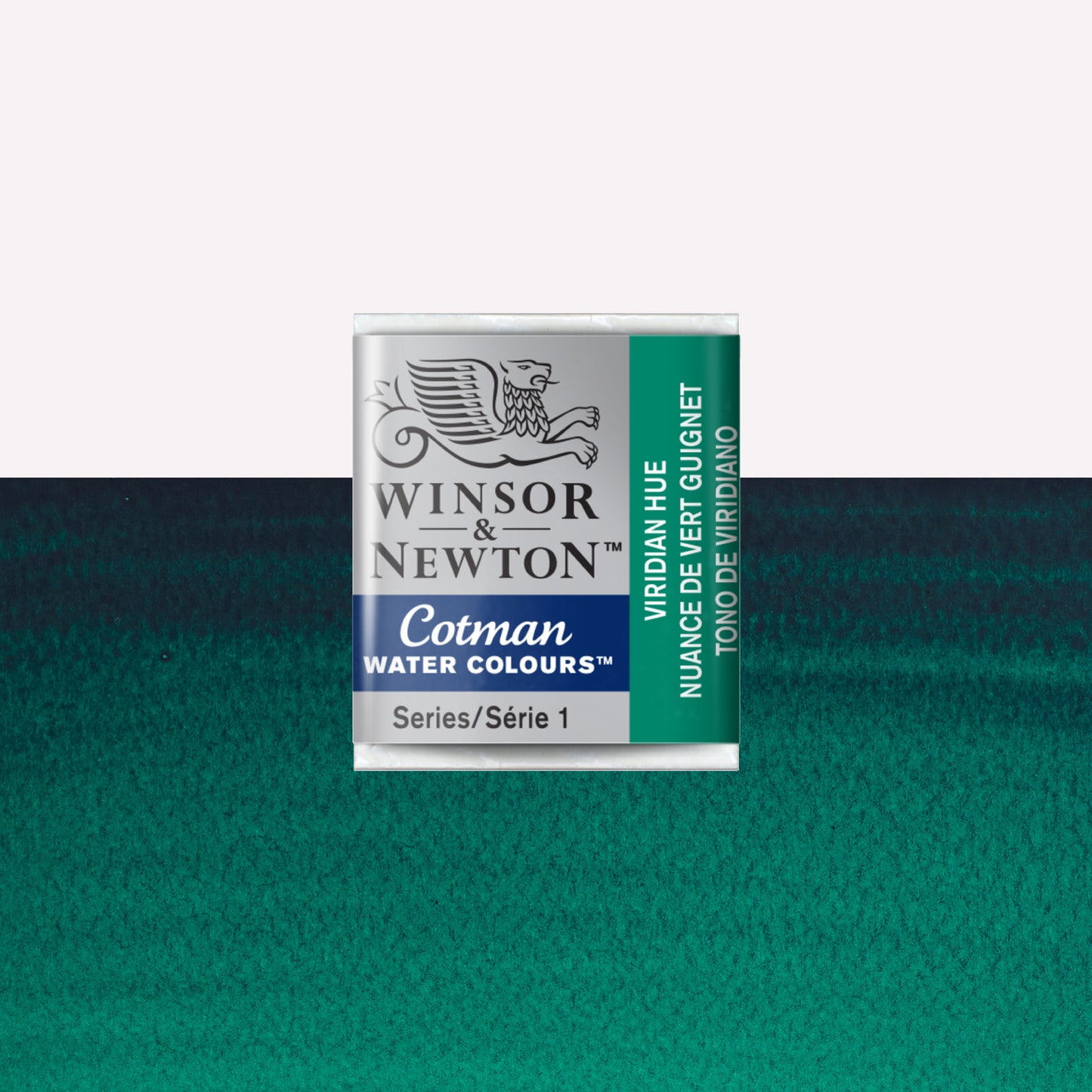 Winsor & Newton Cotman watercolour half pan in the shade Viridian Hue over a vibrant colour swatch. These half pans have a solid formula and are packaged in compressed paint cake. 