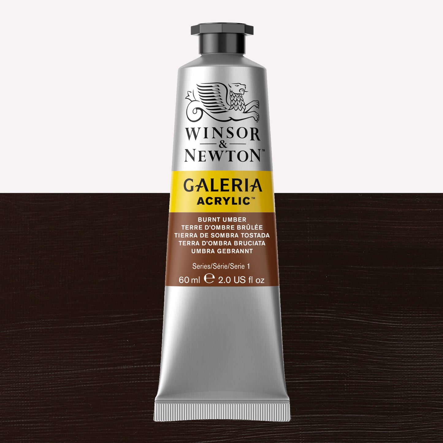 A 60ml tube of vibrant Galeria Acrylic paint in the shade Burnt Umber. This professional-quality paint is packaged in a silver tube with a black lid. Made by Winsor and Newton.