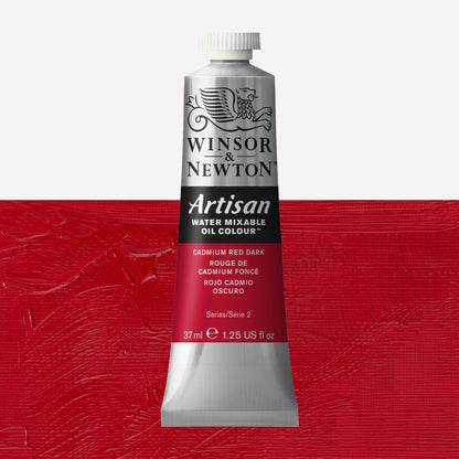 A 37ml silver tube of Winsor & Newton, Artisan Water Mixable Oil Colour in the shade Cadmium Dark Red, over a beautifully pigmented colour swatch. 