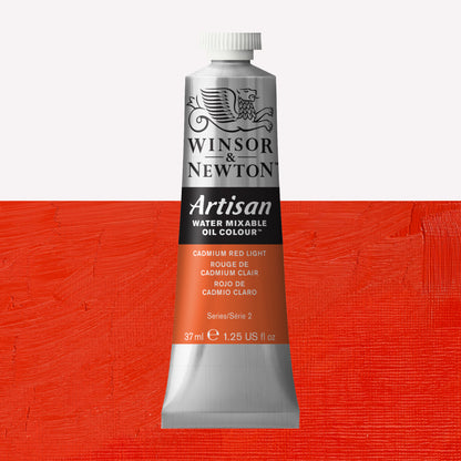 A 37ml silver tube of Winsor & Newton, Artisan Water Mixable Oil Colour in the shade Cadmium Red Light, over a beautifully pigmented colour swatch. 