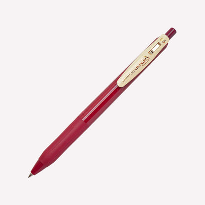 Zebra Sarasa Clip 05 Gel pens in Cassis Black with a dark red barrel and a cream clip showing the logo. 